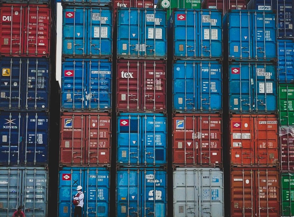Colorful stacked cargo containers at a shipping yard in Jakarta, Indonesia.